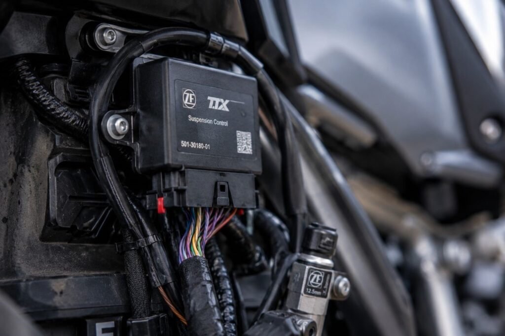 Electronic suspension control unit installed on a touring motorcycle