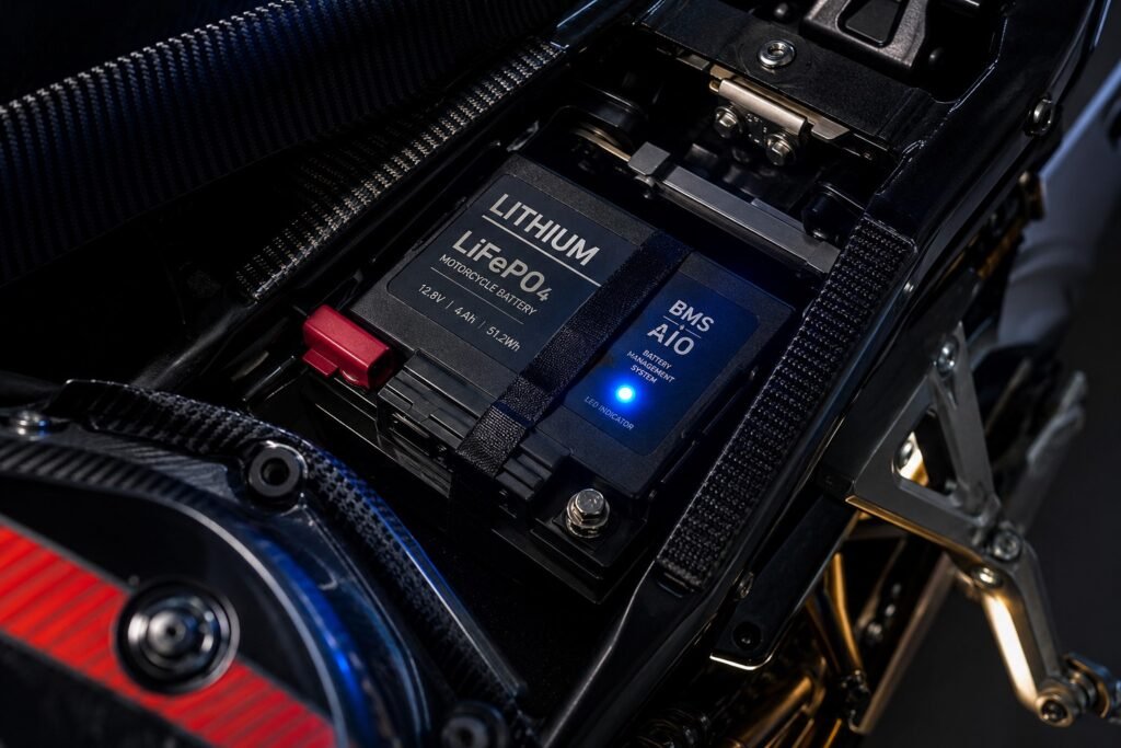 Lithium LiFePO4 motorcycle battery with smart BMS indicator light installed in sportbike