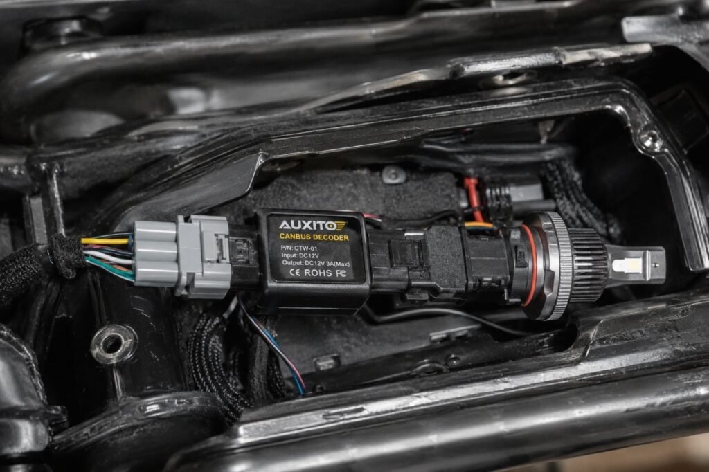 CANbus decoder module wired inline in motorcycle lighting harness to prevent dashboard error codes