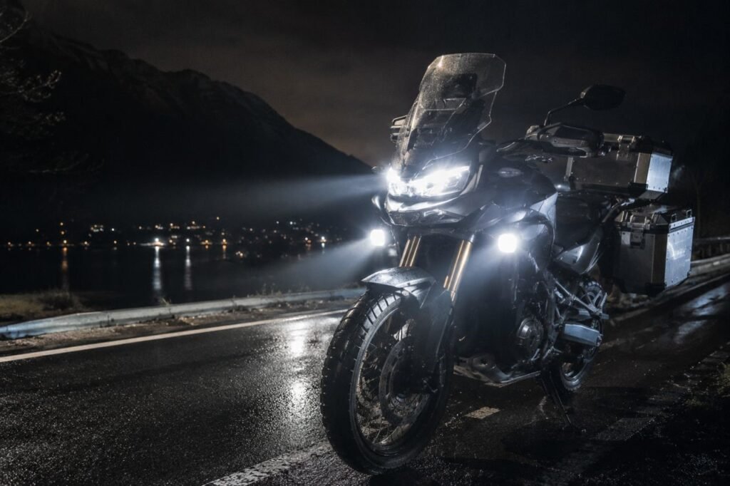 Motorcycle LED auxiliary lights illuminating road at night