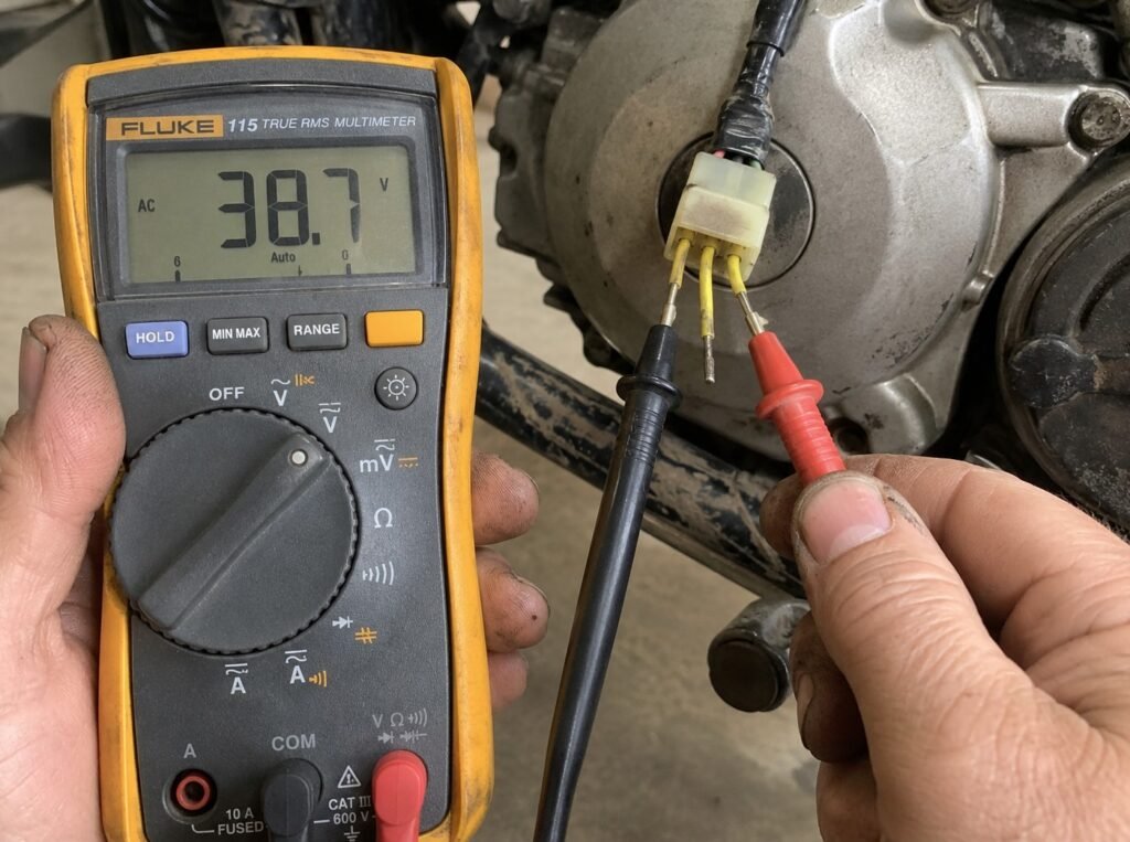 Testing motorcycle stator AC output voltage with a multimeter on 3-phase wires