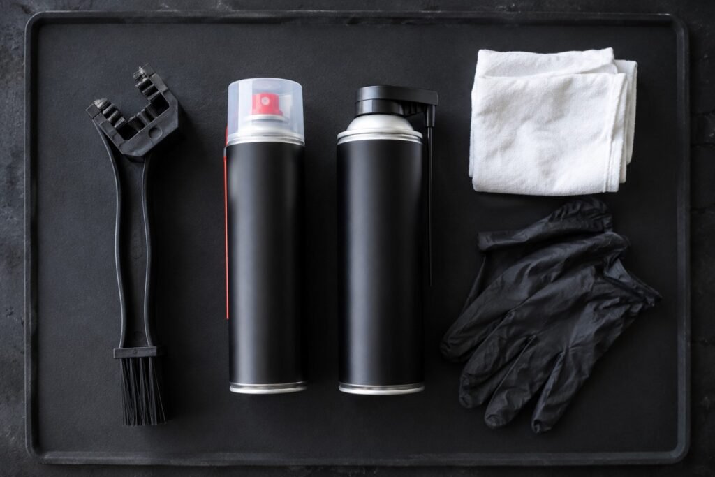 Motorcycle chain cleaning tools including brush, cleaner spray, and lubricant