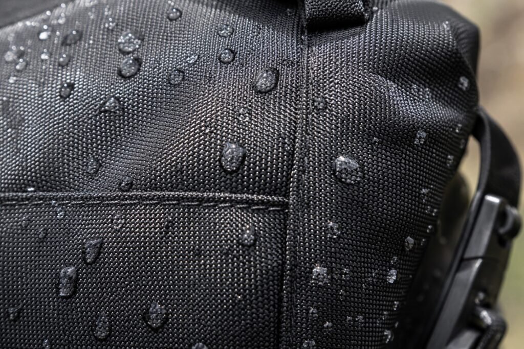 Ballistic nylon roll-top motorcycle dry bag close-up showing fabric weave