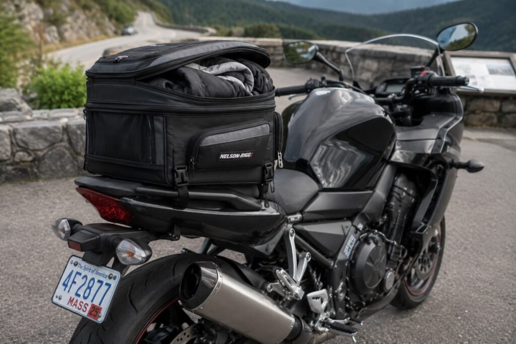 Expandable motorcycle tail bag with perimeter zipper unzipped