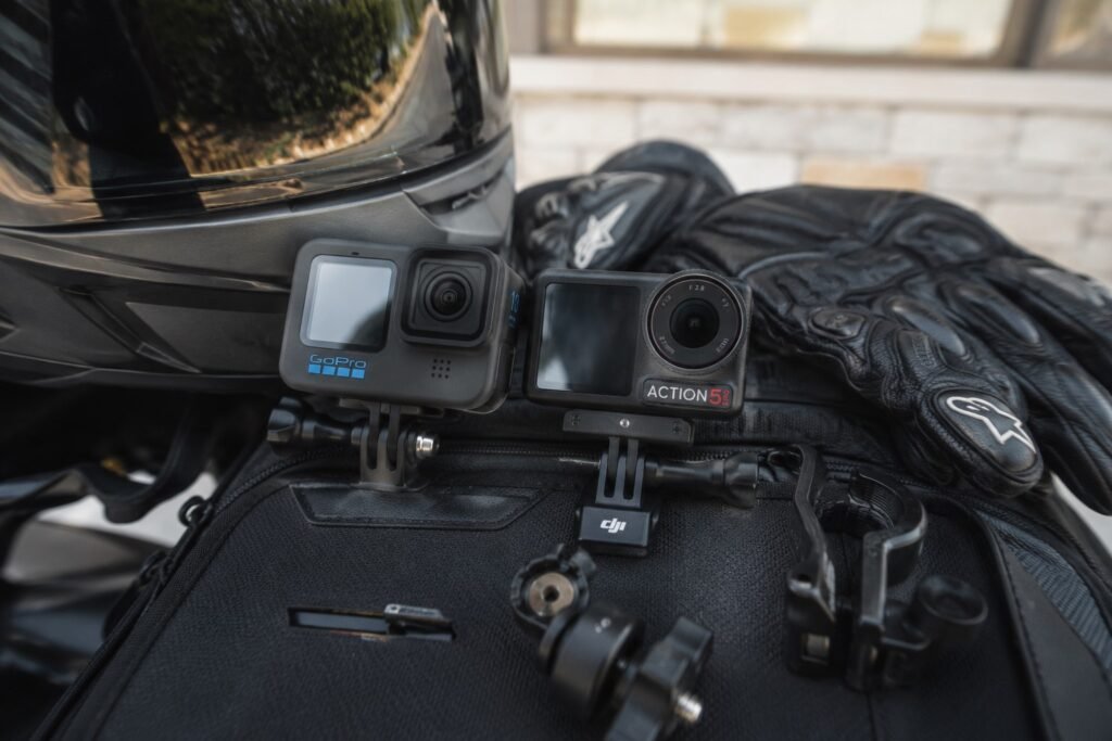 GoPro Hero 13 and DJI Osmo Action 5 Pro side by side for motorcycle camera comparison