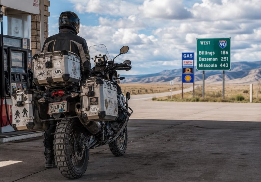 Touring motorcycle with locked hard panniers parked at a highway rest stop