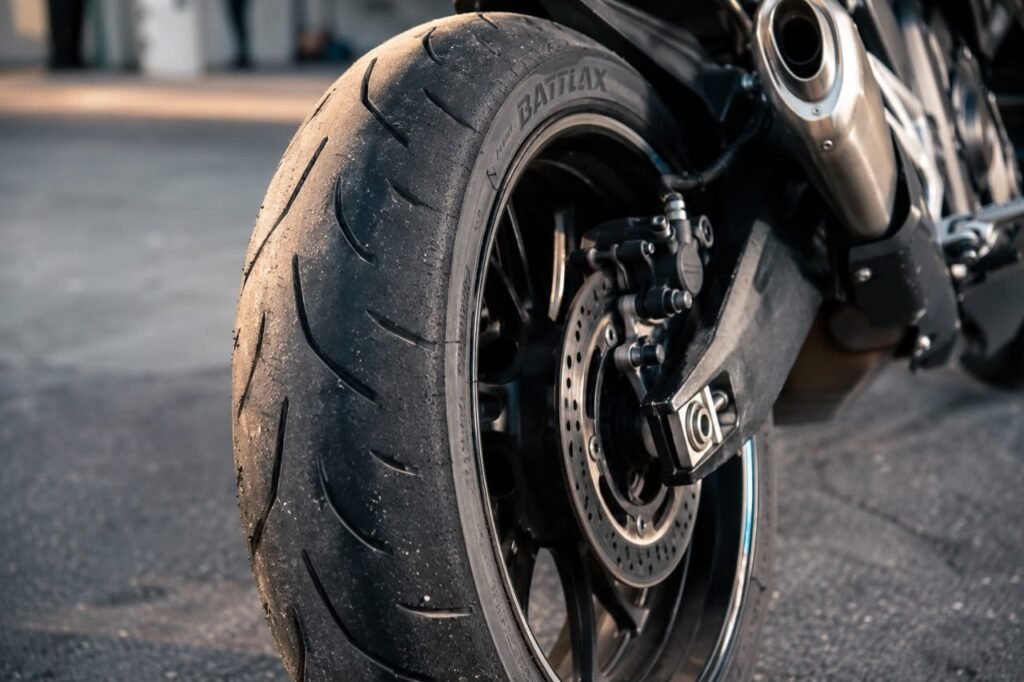 Close-up of motorcycle tire sidewall showing size numbers for reading tire sizes