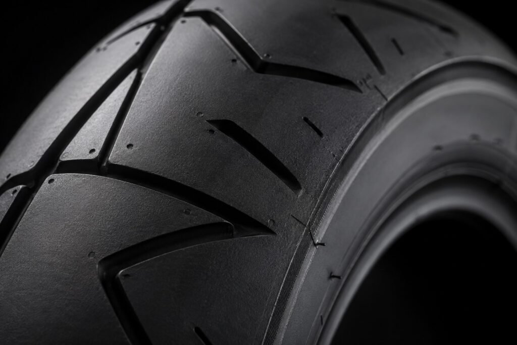Close-up of motorcycle tire tread showing internal construction