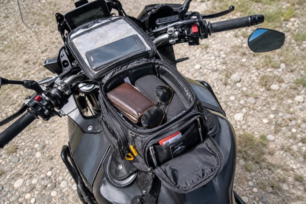Open motorcycle tank bag showing main compartment and clear phone pocket